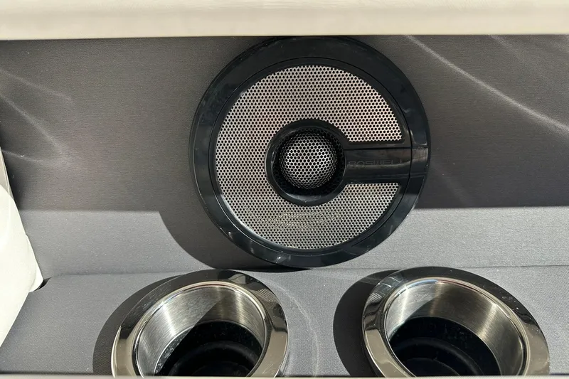 Slide: The Image of Speaker and cup holders on 2021 Bennington 25 RXSBA boat interior. - 52