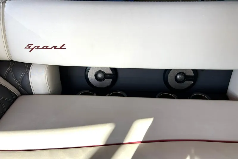 Slide: The Image of 2021 Bennington 25 RXSBA boat interior with "Sport" logo and speaker system. - 53