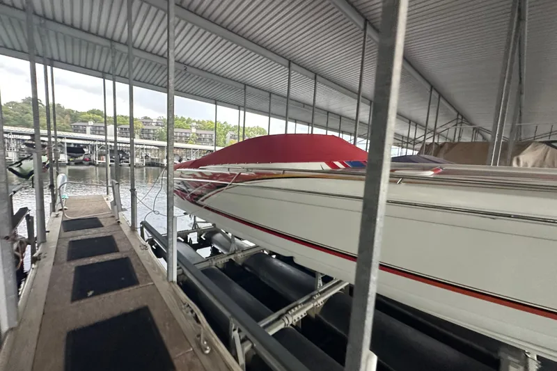 Slide: The Image of Covered 2000 Formula 353 FASTech boat docked in a marina. - 10