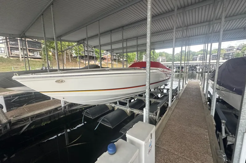 Slide: The Image of 2000 Formula 353 FASTech boat docked in covered marina slip. - 15