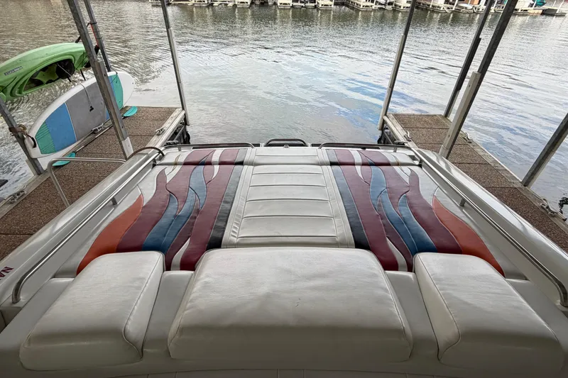 Slide: The Image of 2000 Formula 353 FASTech boat with colorful upholstery, docked near water. - 18