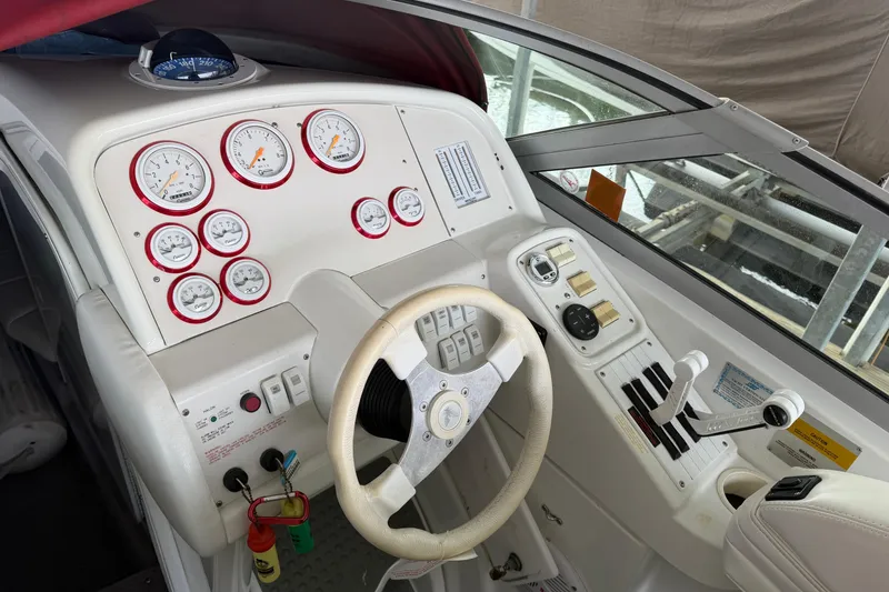 Slide: The Image of Cockpit of a 2000 Formula 353 FASTech boat with gauges and steering wheel. - 19