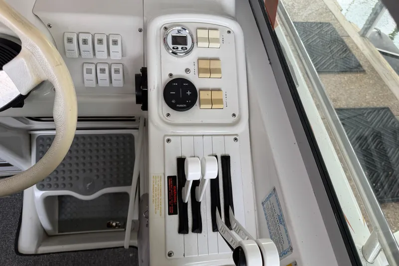 Slide: The Image of Control panel of a 2000 Formula 353 FASTech boat with steering wheel and switches. - 20