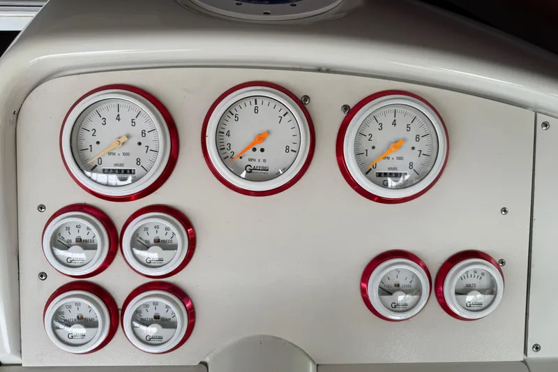 Slide: The Image of Dashboard of a 2000 Formula 353 FASTech boat with multiple gauges and dials. - 21