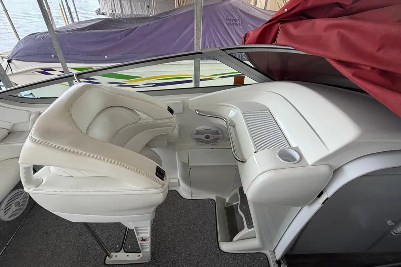 Slide: The Image of 2000 Formula 353 FASTech boat interior with white seating and dashboard. - 24