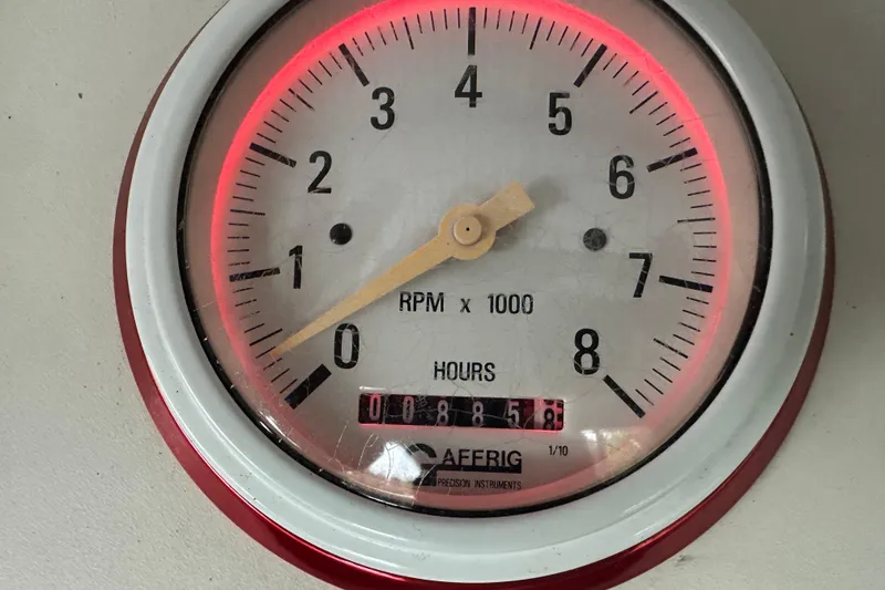 Slide: The Image of Tachometer gauge from a 2000 Formula 353 FASTech, displaying RPM and hours. - 25