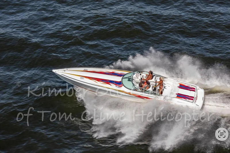 Slide: The Image of 2000 Formula 353 FASTech speedboat racing on open water with passengers. - 3