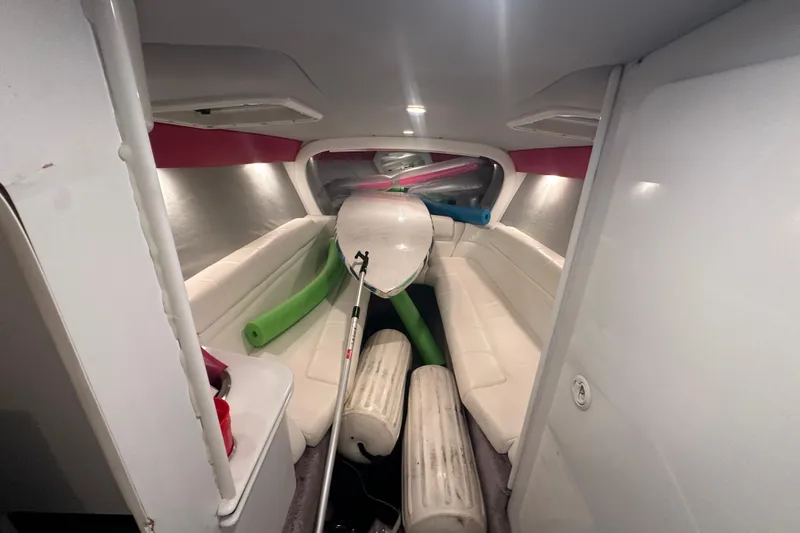 Slide: The Image of Interior of a 2000 Formula 353 FASTech boat with seating and stored equipment. - 33