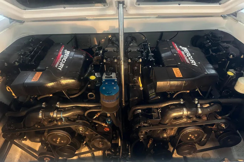 Slide: The Image of Twin Mercury engines in a 2000 Formula 353 FASTech boat engine compartment. - 38