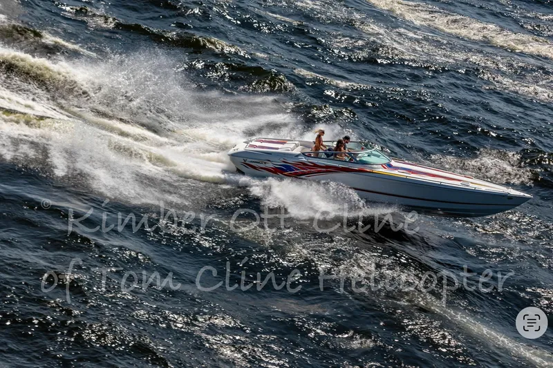 Slide: The Image of 2000 Formula 353 FASTech speedboat racing on choppy water, creating dynamic waves. - 4