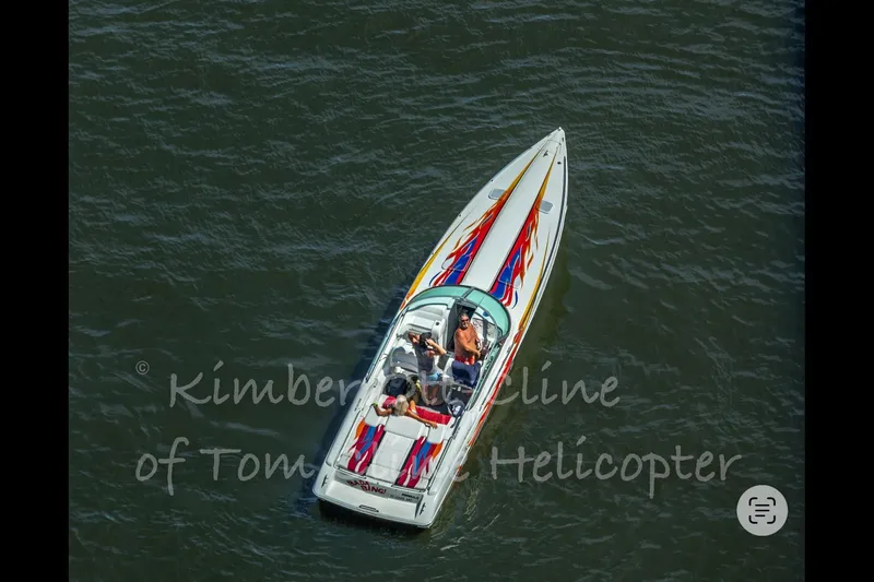 Slide: The Image of Aerial view of 2000 Formula 353 FASTech speedboat on water. - 6