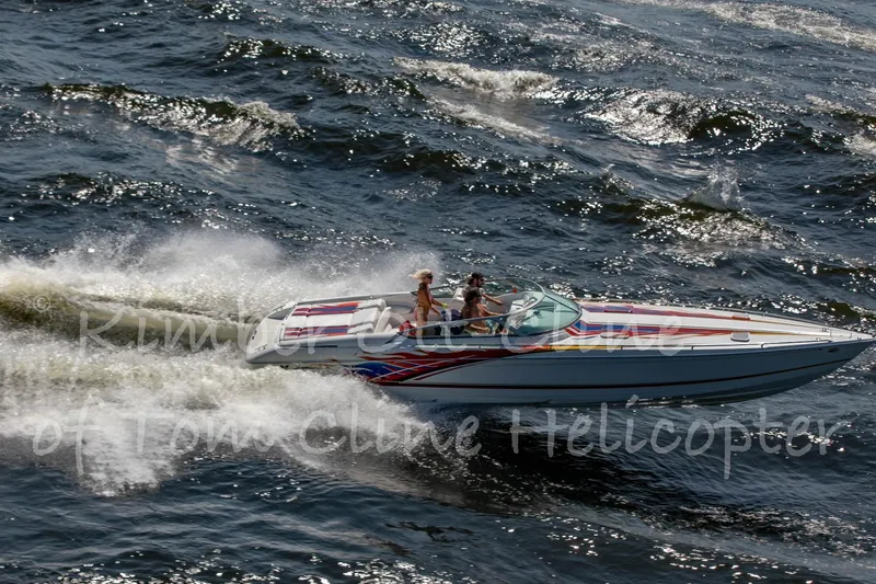 Slide: The Image of 2000 Formula 353 FASTech speedboat cruising on open water. - 7