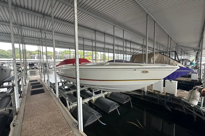 Slide: The Image of 2000 Formula 353 FASTech boat docked in covered marina. - 8