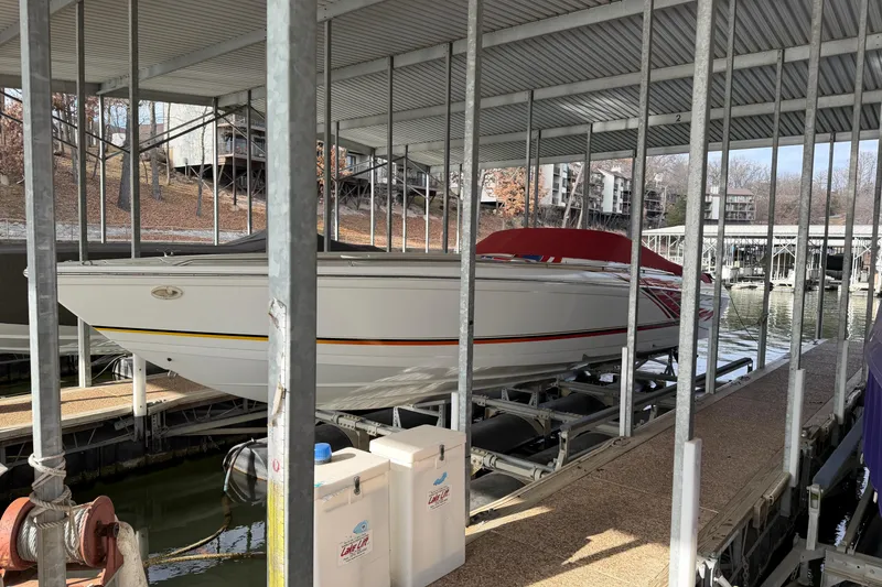 Slide: The Image of 2000 Formula 353 FASTech boat docked under covered marina. - 9