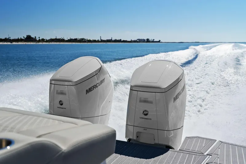 Slide: The Image of Cruisers Yachts 42 GLS OB 2026 with Mercury outboard engines on water. - 11