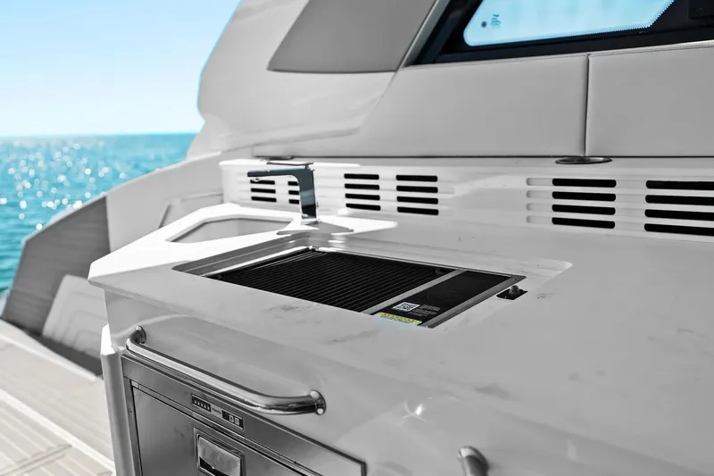 Slide: The Image of Outdoor kitchen on 2026 Cruisers Yachts 42 GLS OB, featuring sleek design and ocean view. - 16
