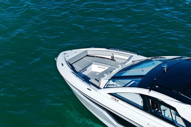 Slide: The Image of 2026 Cruisers Yachts 42 GLS OB on clear blue water, showcasing sleek design. - 22