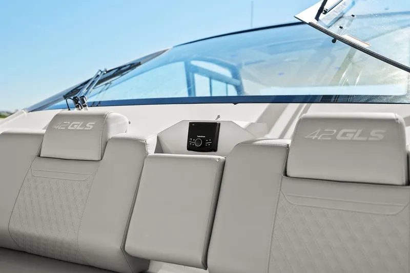 Slide: The Image of 2026 Cruisers Yachts 42 GLS OB interior with luxurious seating and modern dashboard. - 25