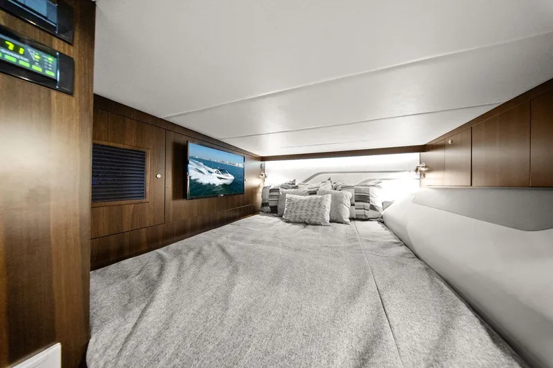 Slide: The Image of Luxurious cabin interior of 2026 Cruisers Yachts 42 GLS OB with cozy bedding and TV. - 29