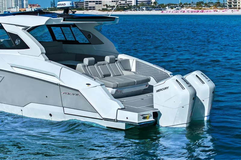 Slide: The Image of 2026 Cruisers Yachts 42 GLS OB with twin Mercury outboards on blue water. - 7