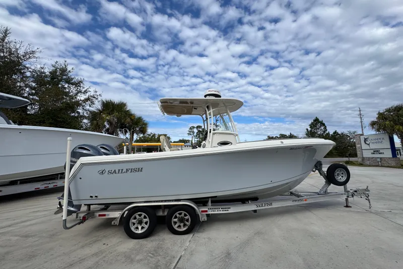 Slide: The Image of 2020 Sailfish 242 CC boat on trailer under cloudy sky at Grander Marine. - 10