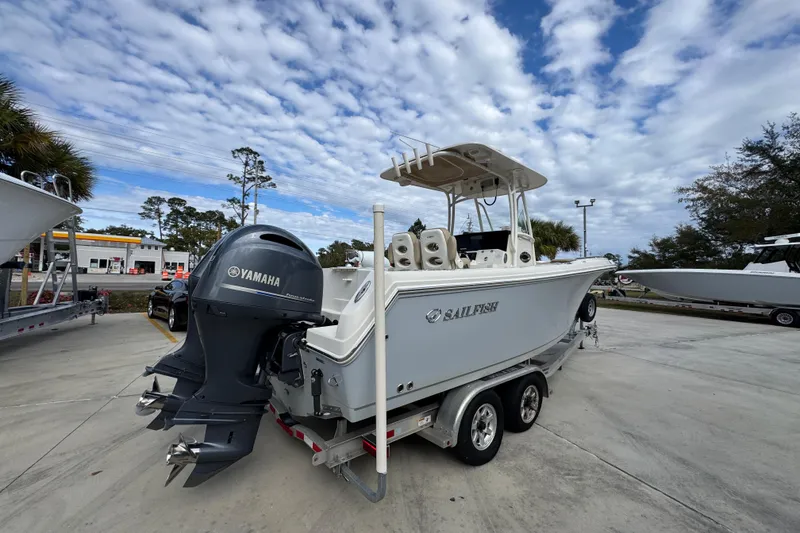 Slide: The Image of 2020 Sailfish 242 CC boat with Yamaha engine on trailer, parked outdoors. - 12