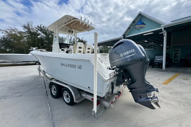 Slide: The Image of 2020 Sailfish 242 CC boat with Yamaha engine on trailer, parked outdoors. - 16