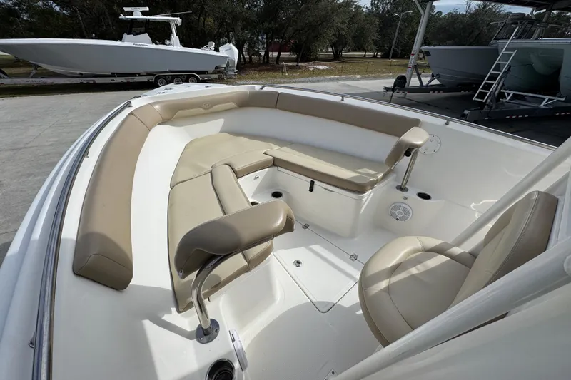 Slide: The Image of 2020 Sailfish 242 CC boat interior with beige seating and spacious layout. - 20