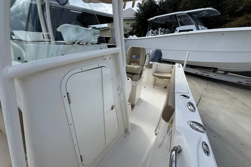 Slide: The Image of 2020 Sailfish 242 CC boat interior with seating and storage compartments. - 24