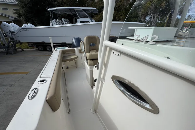 Slide: The Image of 2020 Sailfish 242 CC boat interior with seating and console details. - 25
