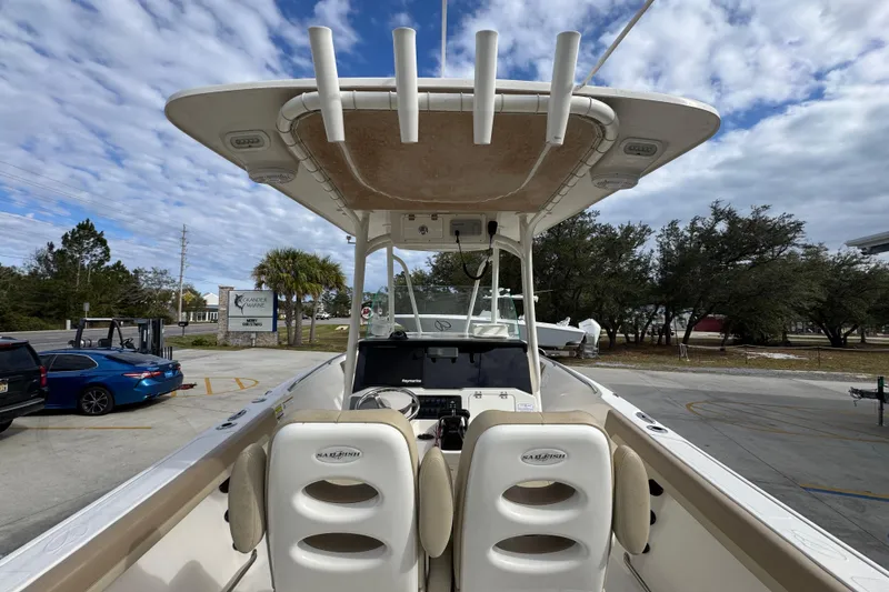Slide: The Image of 2020 Sailfish 242 CC boat interior with dual seats and overhead rod holders. - 37