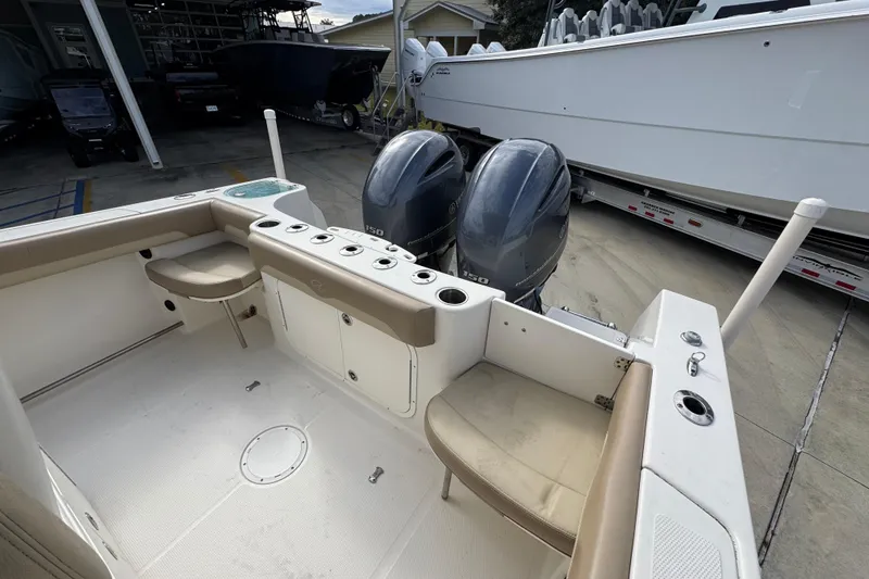 Slide: The Image of 2020 Sailfish 242 CC boat interior with twin outboard engines and seating. - 38