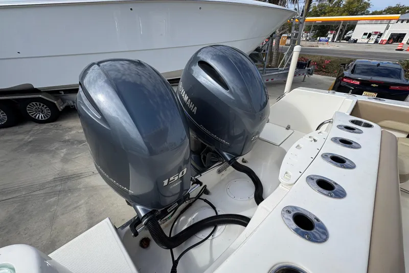 Slide: The Image of 2020 Sailfish 242 CC boat with dual Yamaha 150 outboard engines. - 41