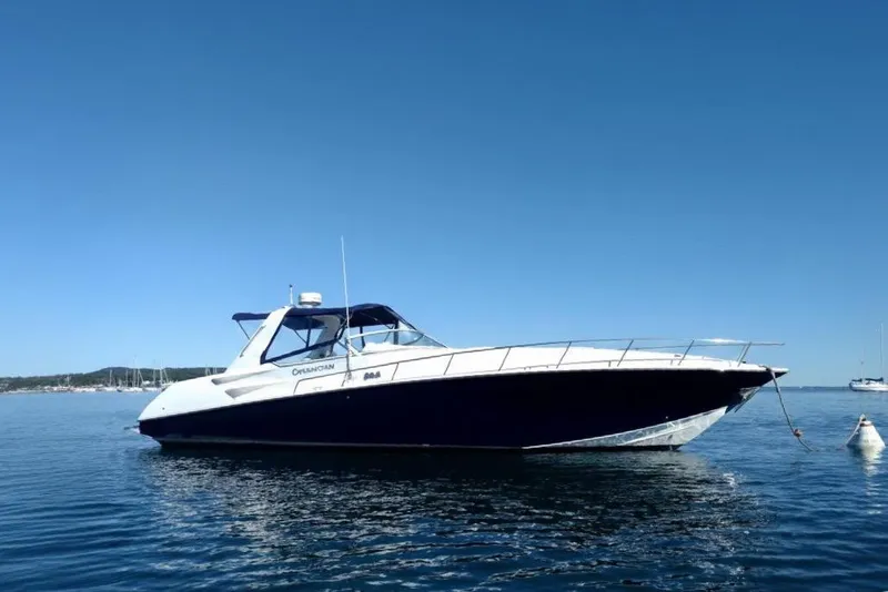 The Image of 2009 Fountain 38 Express Cruiser on calm blue water under clear sky. - 0