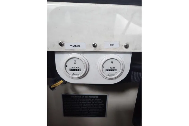 Slide: The Image of Control panel of 2009 Fountain 38 Express Cruiser with hour meters for starboard and port engines. - 13