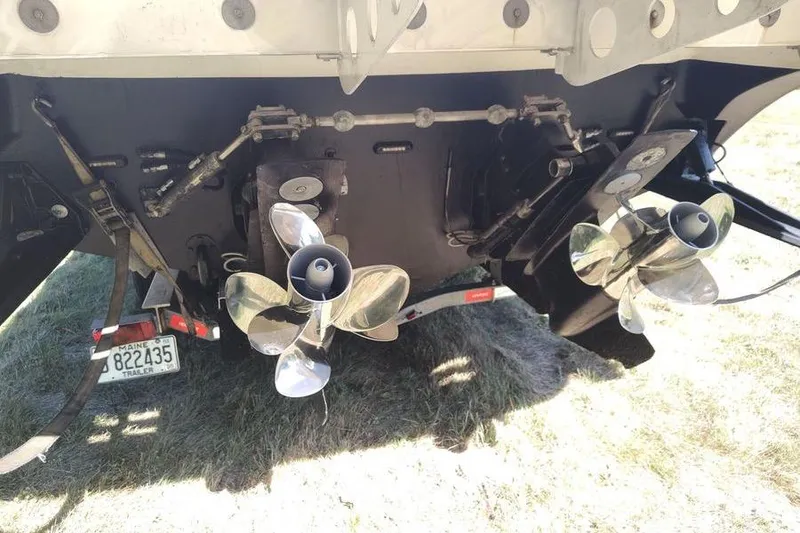 Slide: The Image of Rear view of 2009 Fountain 38 Express Cruiser with dual propellers and trailer. - 14