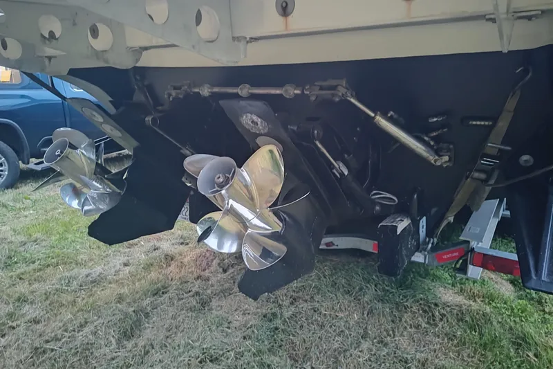 Slide: The Image of 2009 Fountain 38 Express Cruiser propellers and stern view on grass. - 15