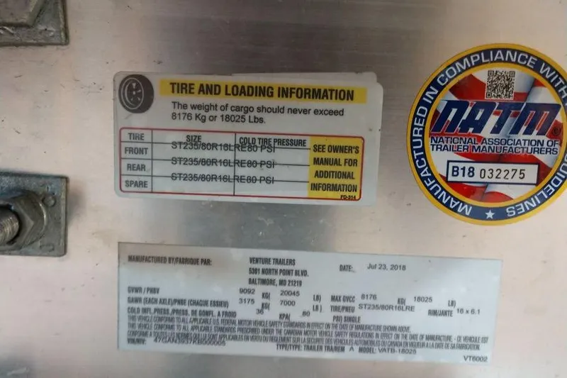 Slide: The Image of Tire and loading information label on 2009 Fountain 38 Express Cruiser trailer. - 16