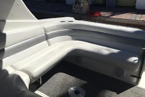 Slide: The Image of 2009 Fountain 38 Express Cruiser interior with white leather seating and carpeted floor. - 3