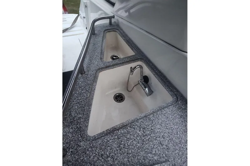 Slide: The Image of 2009 Fountain 38 Express Cruiser sink area with dual basins and chrome faucet. - 4