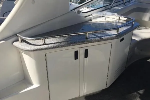 Slide: The Image of 2009 Fountain 38 Express Cruiser interior with sleek countertop and storage cabinets. - 5