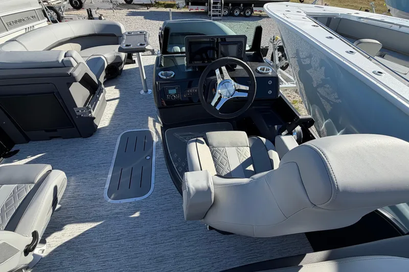 Slide: The Image of Interior of 2026 Bennington 22 MFB boat with modern steering and seating. - 6