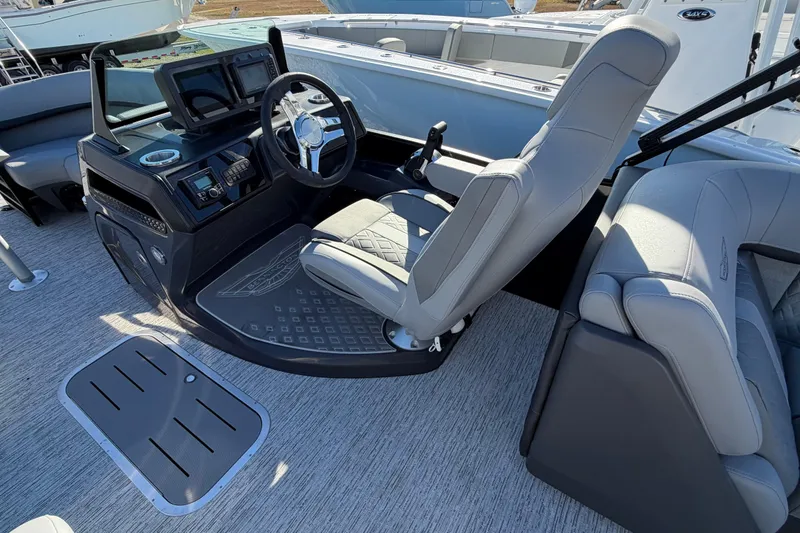 Slide: The Image of 2026 Bennington 22 MFB boat interior with modern helm and seating. - 8