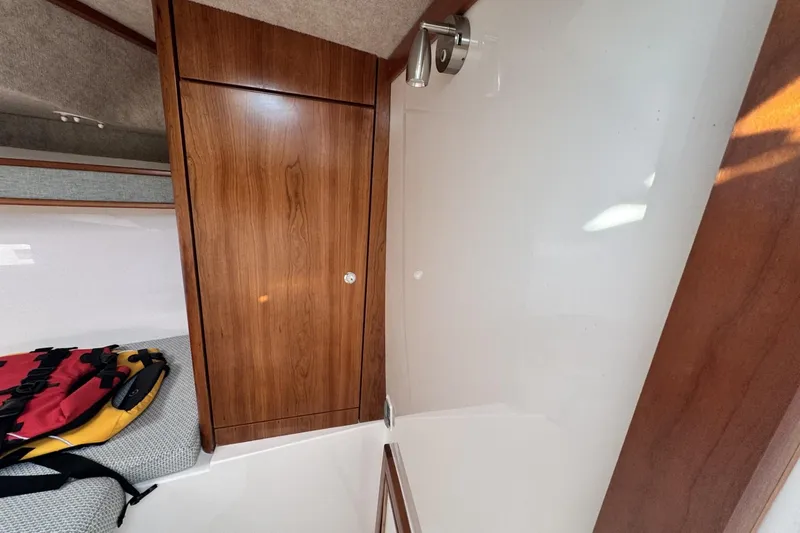 Slide: The Image of 2022 Albemarle 25 Express boat cruising on open water under clear blue sky. - 10