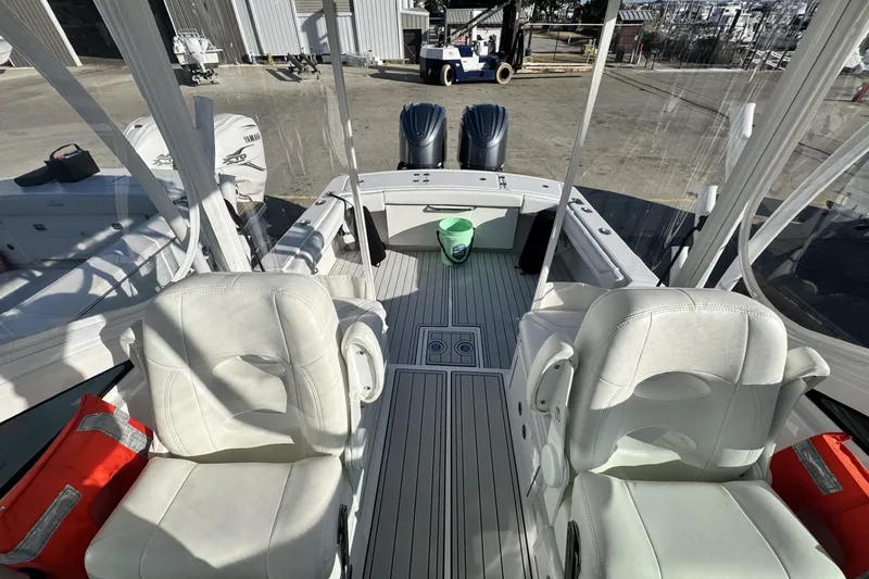 Slide: The Image of 2022 Albemarle 25 Express boat cruising on open water. - 11