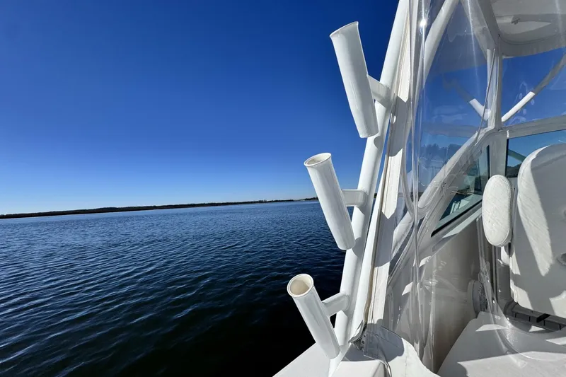 Slide: The Image of 2022 Albemarle 25 Express boat on calm water under clear blue sky. - 24