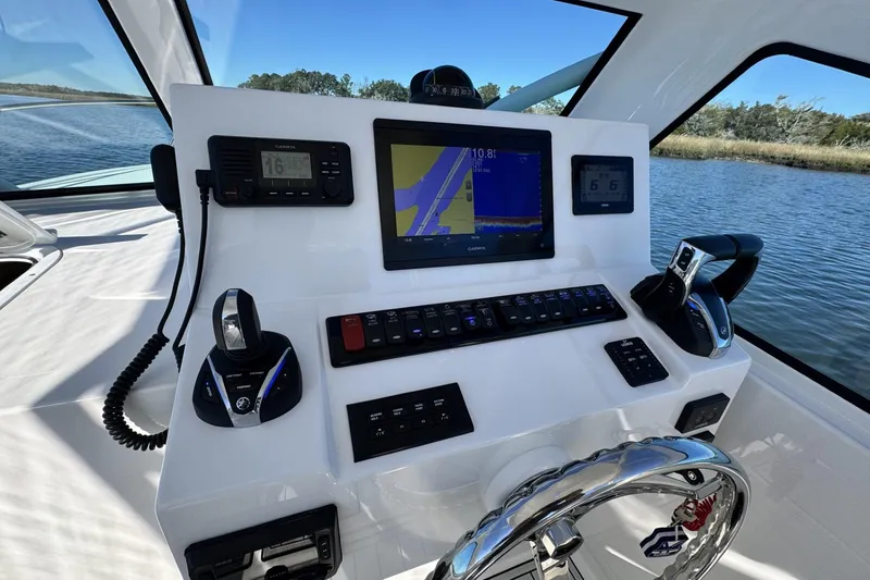 Slide: The Image of Helm of 2022 Albemarle 25 Express with navigation and control systems. - 30