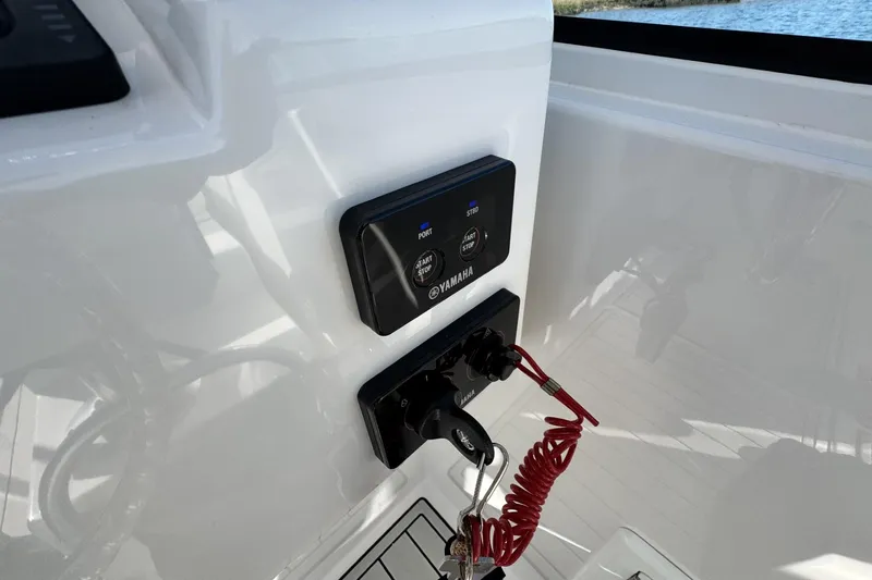 Slide: The Image of Control panel of 2022 Albemarle 25 Express boat with Yamaha start/stop buttons. - 35