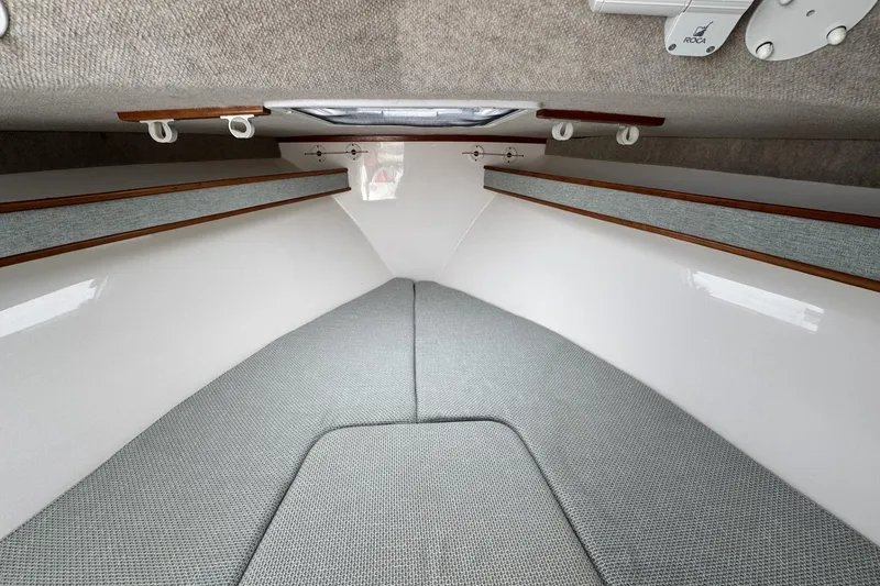 Slide: The Image of Interior cabin of 2022 Albemarle 25 Express boat with cushioned seating. - 41