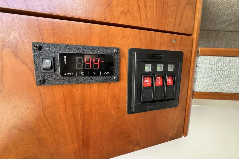 Slide: The Image of Control panel on 2022 Albemarle 25 Express boat, featuring digital display and switches. - 43